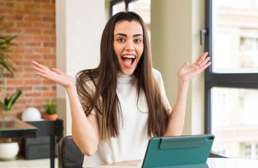 excited happy girl with tab