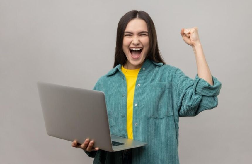 excited happy girl with laptop