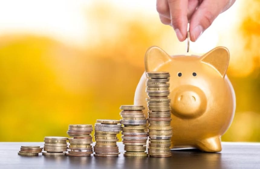 putting coin in a piggy bank