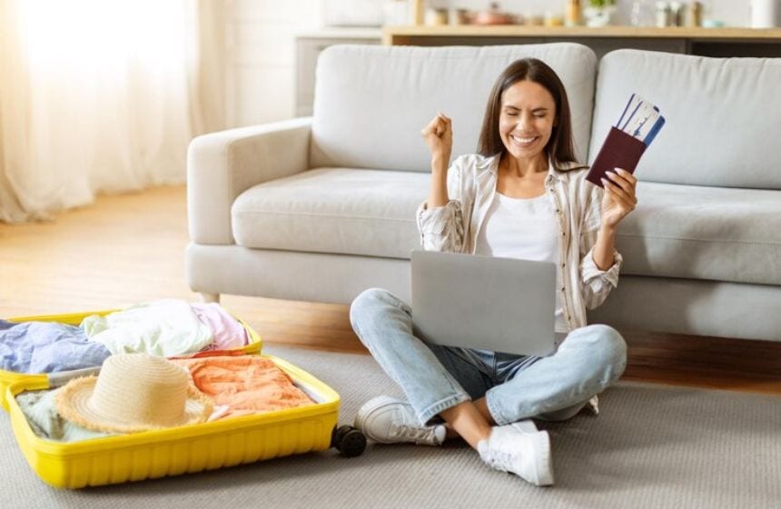 excited lady holding japan visa and luggage on the floor