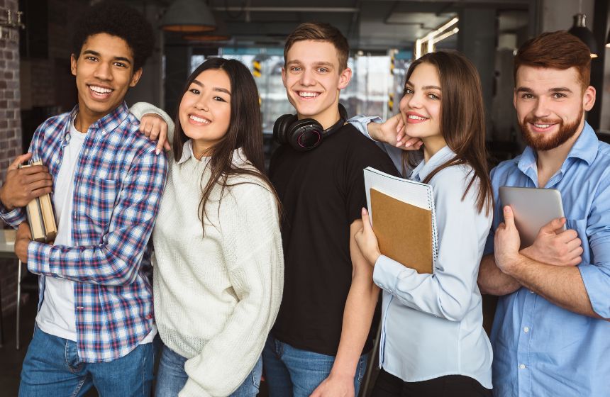 international students standing holding files